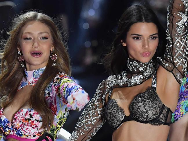 TOPSHOT - from L to R : Canadian model Winnie Harlow, US model Gigi Hadid, US model Kendall Jenner and British model Alexina Graham walks the runway at the 2018 Victoria's Secret Fashion Show on November 8, 2018 at Pier 94 in New York City. - Every year, the Victoria's Secret show brings its famous models together for what is consistently a glittery catwalk extravaganza. It's the most-watched fashion event of the year (800 million tune in annually) with around 12 million USD spent on putting the spectacle together according to Harper's Bazaar. (Photo by Angela Weiss / AFP)