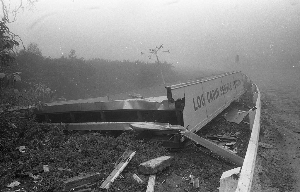 Historic: Toowoomba: Accidents: Clean up at the Log Cabin Service Station the morning after a semi-trailer rolled and crashed in the building removing most of the front of the station. The owner in 1978, Mr Neville Hammond started rebuilding immediately. Photo: Bruce Mackenzie / The Chronicle Neg: U875. Picture: Bruce Mackenzie