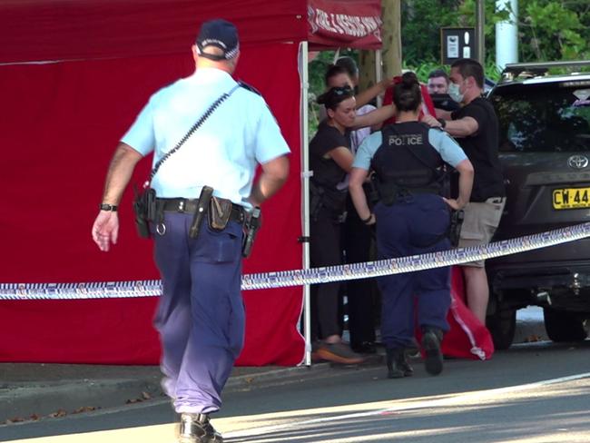 Police set up privacy screens on a footpath near Blacktown Police Station, where the teen’s body remained on Friday night. Picture: TNV