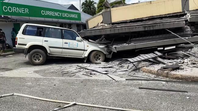 A car trapped underneath a collapsed building in Vanuatu's capital Port Vila. Picture: Michael Thompson/Facebook/AFP