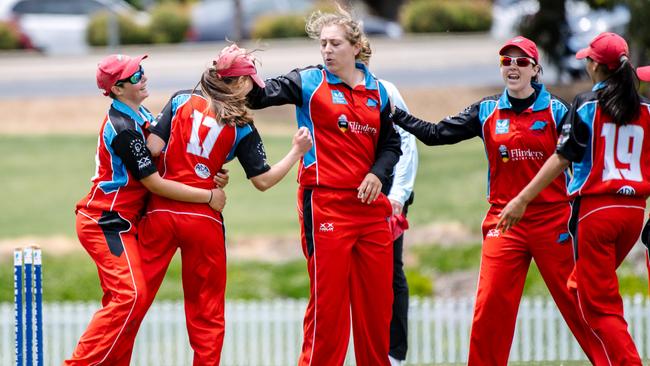 Souther Districts players celebrate during the women’s Twenty20 grand final against Kensington at Karen Rolton Oval on Saturday. Picture: AAP/Morgan Sette