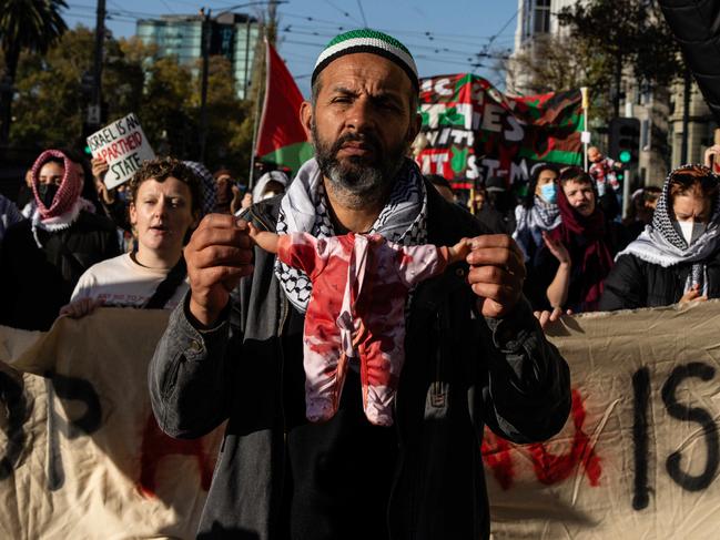 MELBOURNE, AUSTRALIA - NewsWire Photos - 31 MAY 2024: Pro-Palestine protesters march through Spring Street towards the Victorian Parliament. Picture: NewsWire / Diego Fedele