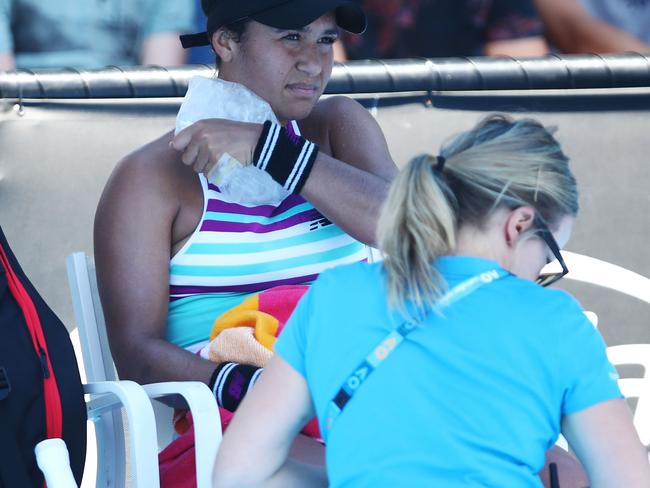 MELBOURNE, AUSTRALIA - JANUARY 14:  Heather Watson of Great Britain receives medical treatment in between games in her first round match against Petra Martic of Croatia during day one of the 2019 Australian Open at Melbourne Park on January 14, 2019 in Melbourne, Australia.  (Photo by Julian Finney/Getty Images)