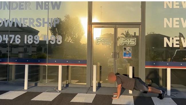 A customer doing push-ups out the front of the gym after learning it had closed down. Picture: news.com.au