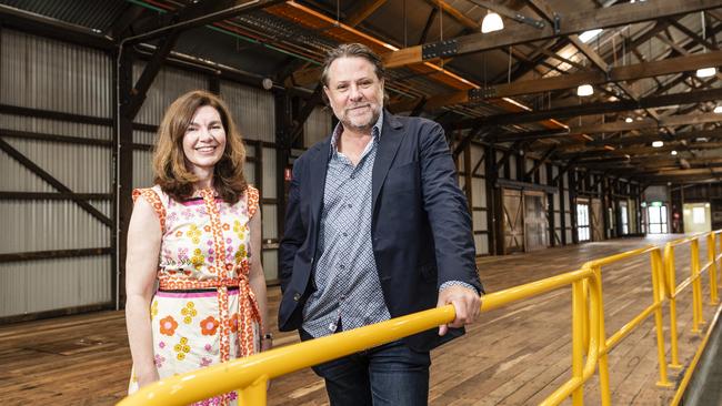 Independent candidate for Groom Suzie Holt shows music promoter and Powderfinger bassist John Collins inside The Goods Shed. Picture: Kevin Farmer