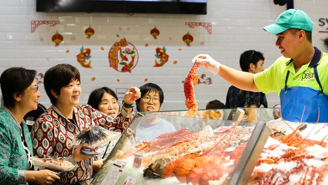 Shoppers Holy Ma and Pinky Lamb buying seafood. Picture: Gaye Gerard