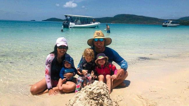 ISLAND FAMILY: Eylsian Eco Retreat owners Laureth and Wayne Rumbe with their children Steel (11 months), Haven 2.5 years, Indio Rumble 3 years, during a recent holiday to Whitehaven Beach. Picture: Contributed