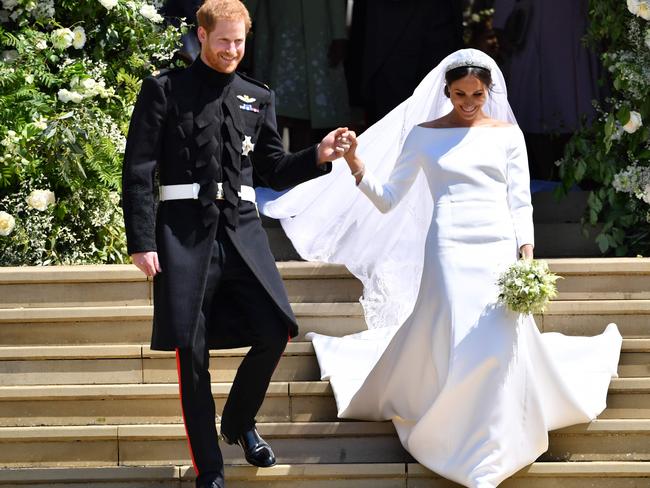 The newlyweds looked thrilled to be reunited. Picture: AFP PHOTO / POOL AND AFP PHOTO / Ben STANSALL