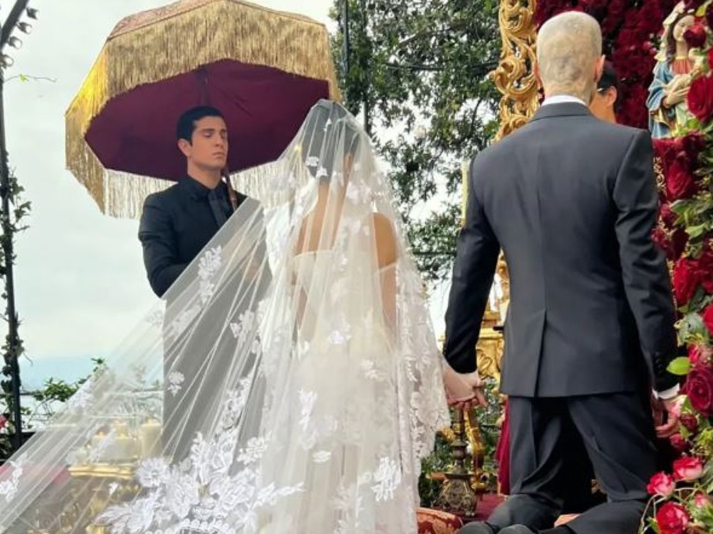 Kourtney Kardashian and Travis Barker at the altar, both wearing custom Dolce &amp; Gabbana. Picture: Instagram