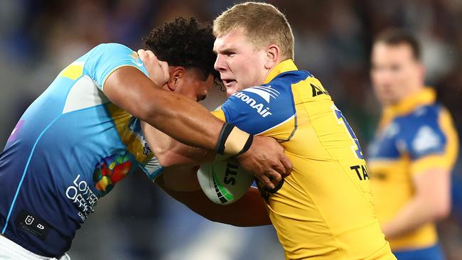 GOLD COAST, AUSTRALIA - JULY 13:  Charlie Guymer of the Eels is tackled during the round 19 NRL match between Gold Coast Titans and Parramatta Eels at Cbus Super Stadium, on July 13, 2024, in Gold Coast, Australia. (Photo by Chris Hyde/Getty Images)