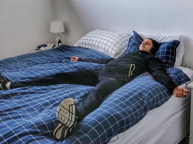 Conditioning: Hall meditates in his bedroom while listening to music. Picture: Colleen Petch