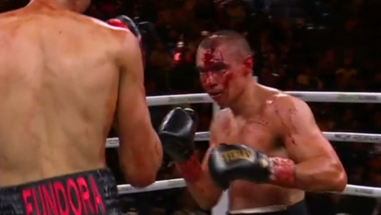 Tszyu was a bleeding mess in the fourth round. Photo: Main Event.