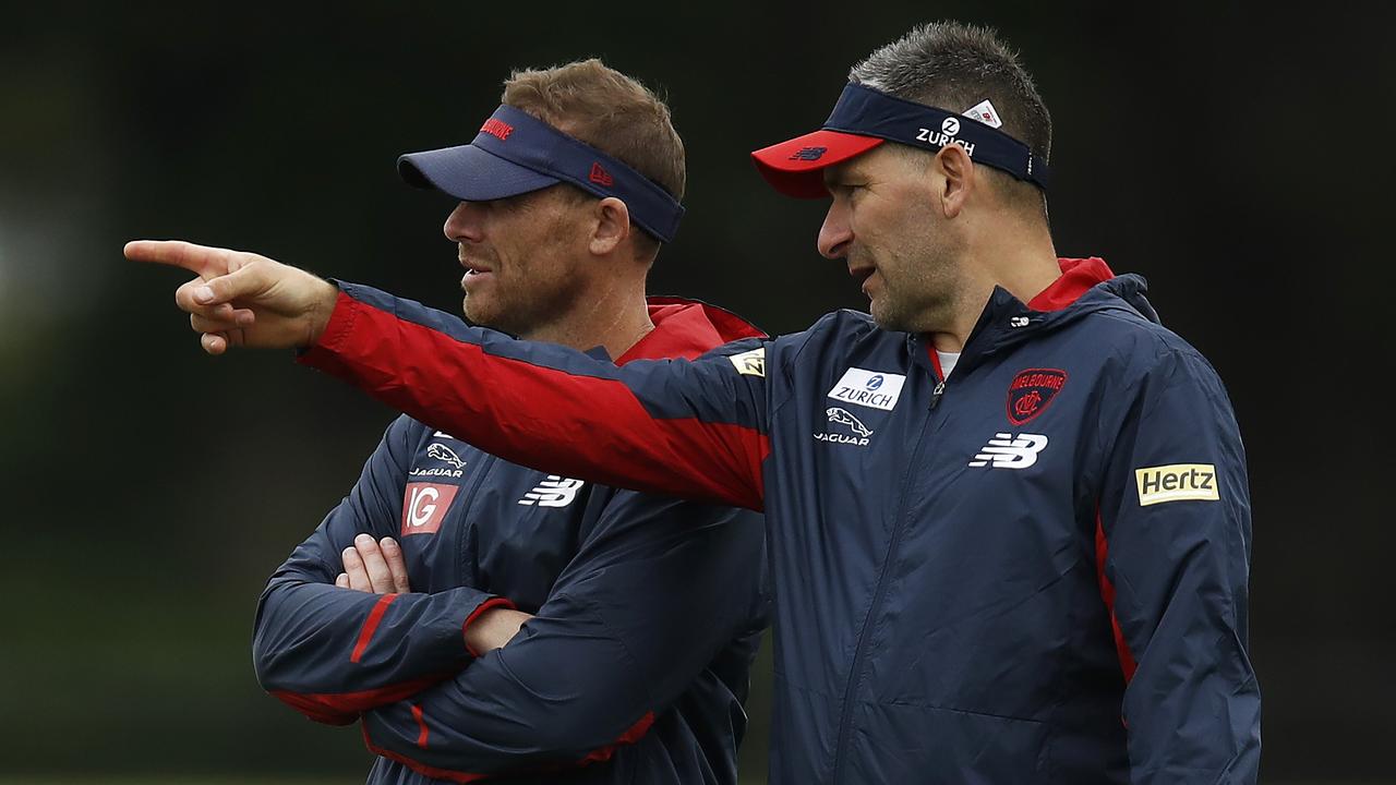 Assistant coach Adem Yze speaks with Goodwin during a training session at Casey Fields.