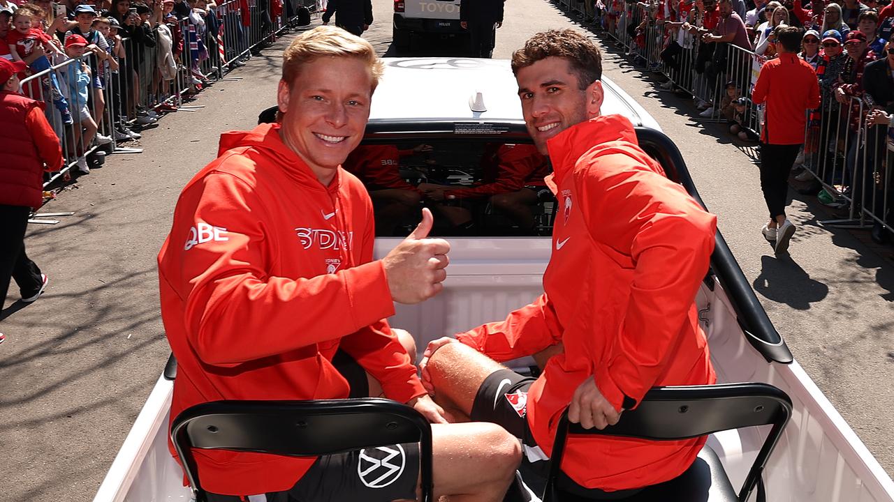 MELBOURNE, AUSTRALIA - SEPTEMBER 27: Isaac Heeney and Robbie Fox of the Swans attend the 2024 AFL Grand Final Parade at Melbourne Park on September 27, 2024 in Melbourne, Australia. (Photo by Robert Cianflone/Getty Images)