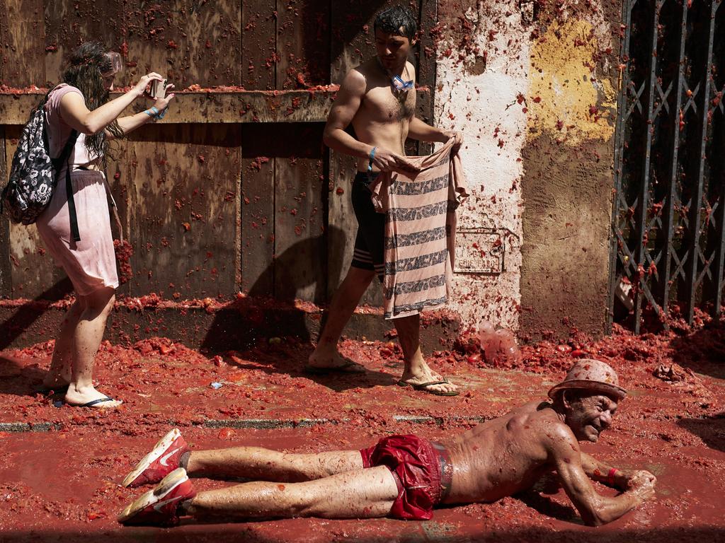 Revellers enjoy the atmosphere – and the sludge. Picture: Manuel Queimadelos Alonso/Getty Images