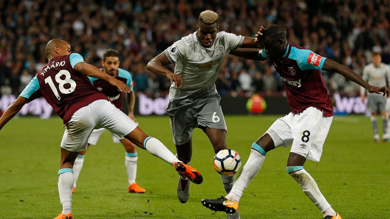 Manchester United's French midfielder Paul Pogba vies for the ball.