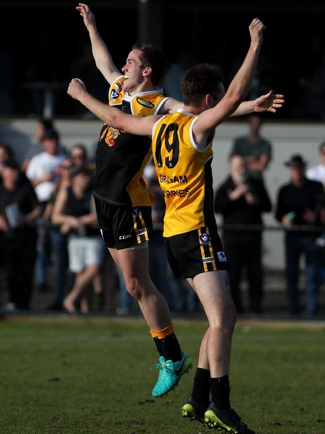 Lachlan Williams and Ryley Hodson of YCW celebrate during the 2017 Peninsula League grand final.