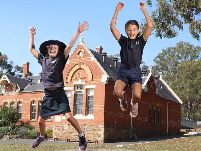 Natalie Egleton and her daughters Alice, 8 , and Essie, 10, at school for the $250k donation by News Corp to the rural and regional schools fund to help children in bushfire affected communities. .Picture: Alex Coppel.