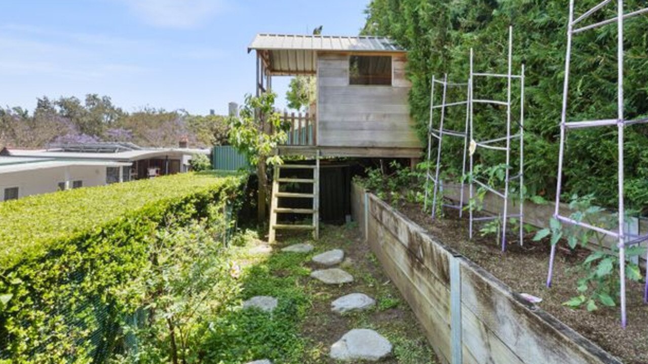 The cubby house and veggie patch in the top garden.