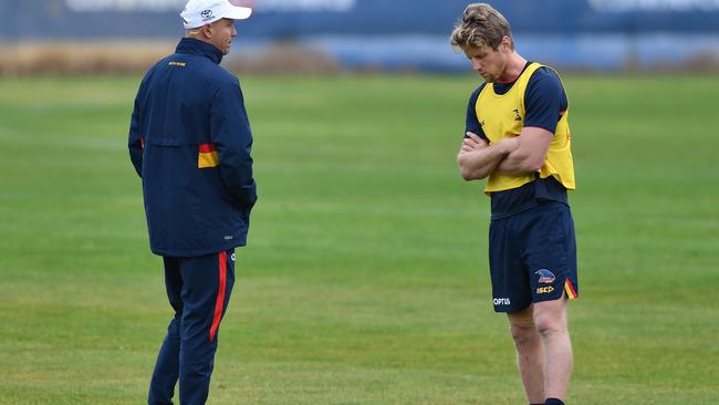 Matthew Nicks speaks with captain Rory Sloane at training. Picture: David Mariuz (AAP).