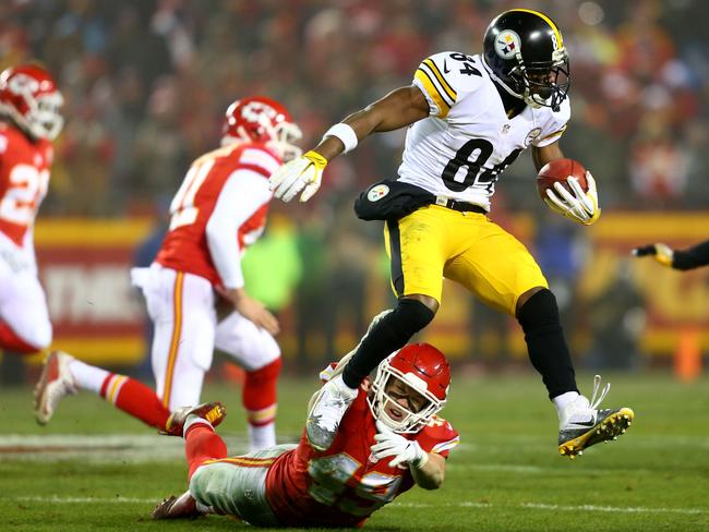 Wide receiver Antonio Brown #84 of the Pittsburgh Steelers runs the ball after catching a pass.
