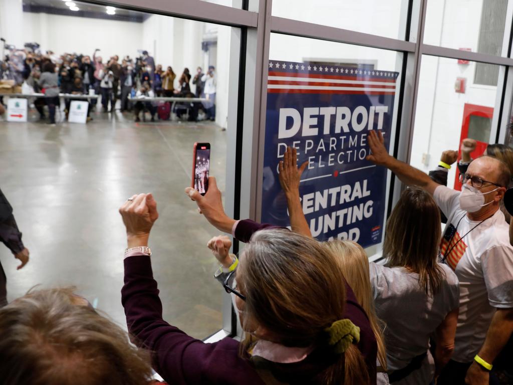 Supporters of US President Donald Trump bang on the glass and chant slogans outside the room where absentee ballots for the 2020 general election are being counted at TCF Centre in Detroit, Michigan. Picture: Jeff Kowalsky/AFP