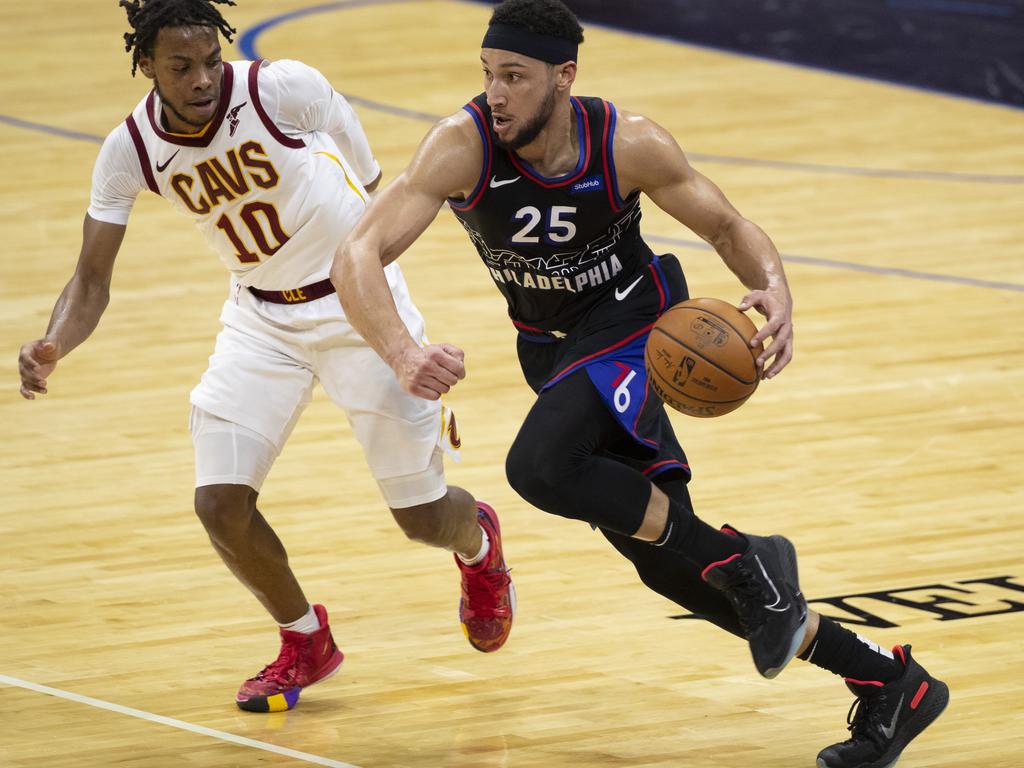 Ben Simmons dribbles the ball against Darius Garland in a February 76ers vs Cavaliers NBA game. Could Simmons end up being traded to the Cavs? Picture: Mitchell Leff/Getty Images