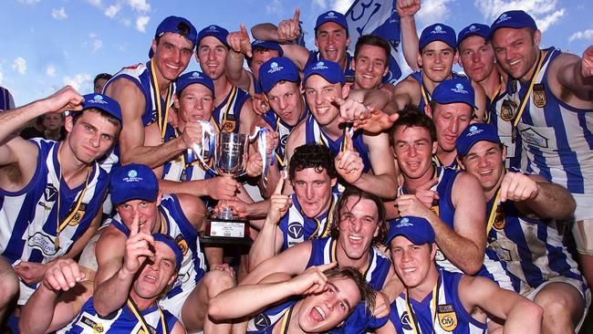 Corowa Rutherglen players celebrate their 2003 win against Wodonga.