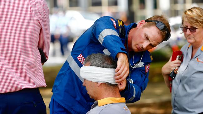 A man is treated for injuries. Picture: Dylan Robinson