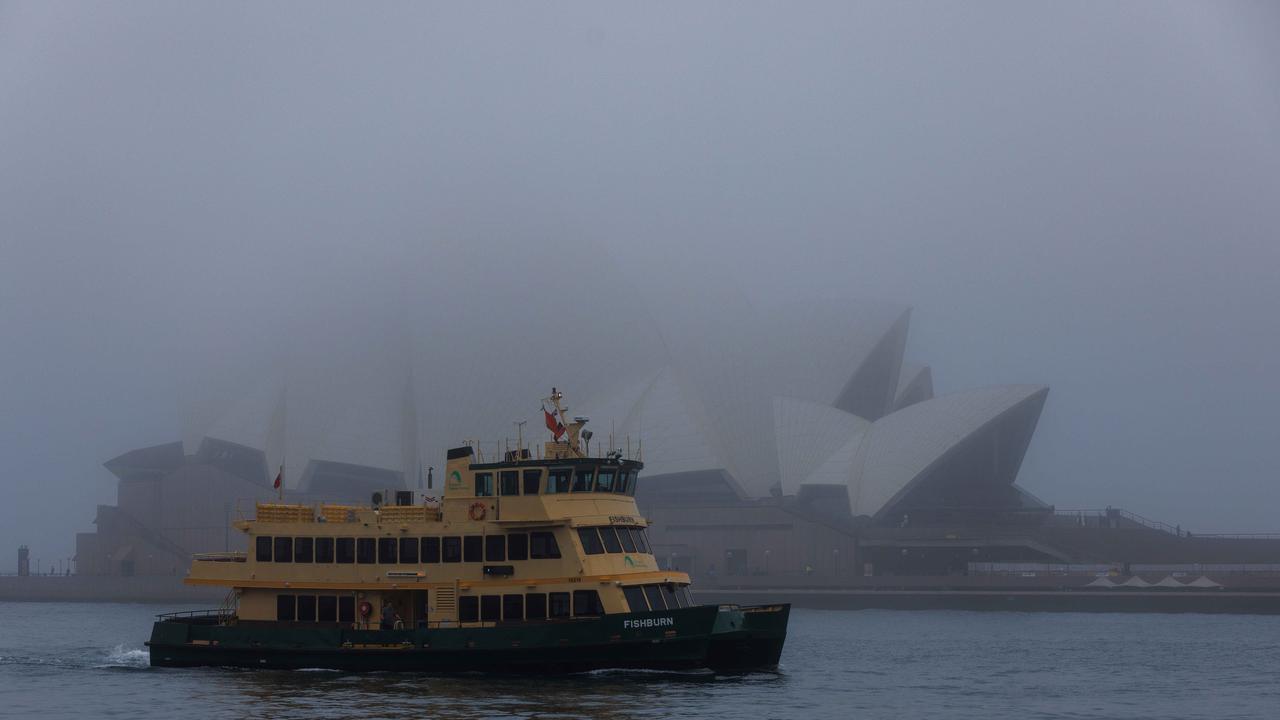 A ferry moves past the iconic Sydney Opera House. Picture: NCA NewsWire / David Swift