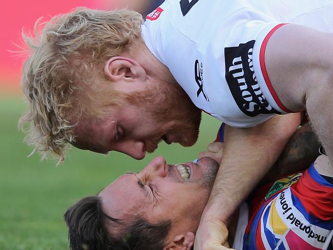 NEWCASTLE, AUSTRALIA - SEPTEMBER 01:  Mitchell Pearce of the Knights is tackled by James Graham of the Dragons during the round 25 NRL match between the Newcastle Knights and the St George Illawarra Dragons at McDonald Jones Stadium on September 1, 2018 in Newcastle, Australia.  (Photo by Ashley Feder/Getty Images)