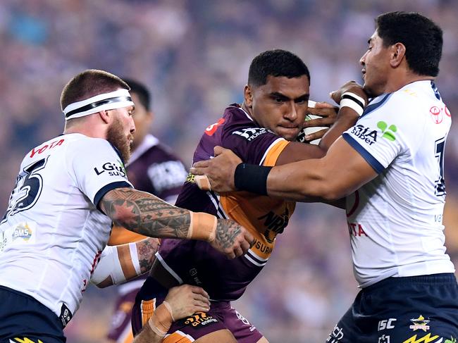 Tevita Pangai Junior challenged Cowboys hard heads (L — R) Josh McGuire and Jason Taumalolo during round two. Picture: Bradley Kanaris/Getty Images