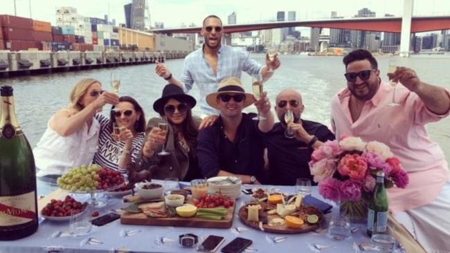 Josh Gibson and Olga Kononchuk (second from the left) celebrated on the water with friends.