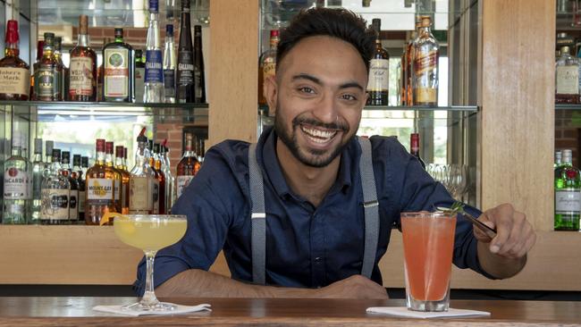 Twisted Cocktail Lounge bar manager Gavin Sabarwal whips up twisted orange and red summer cocktails. Picture: Andy Brownbill