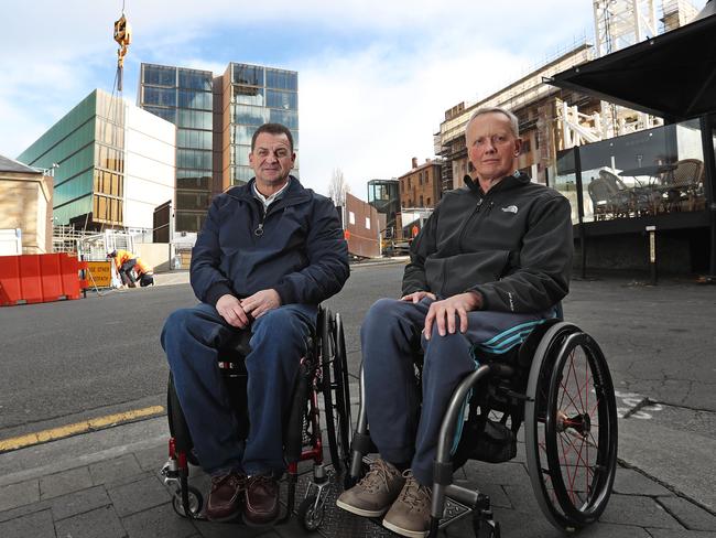 David Cawthorn, left, and Jim Busby outside the Parliament Square construction site. Picture: LUKE BOWDEN