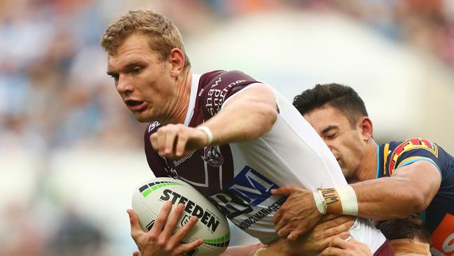 GOLD COAST, AUSTRALIA - JUNE 29: Tom Trbojevic of the Sea Eagles is tackled during the round 15 NRL match between the Gold Coast Titans and the Manly Sea Eagles at Cbus Super Stadium on June 29, 2019 in Gold Coast, Australia. (Photo by Chris Hyde/Getty Images)