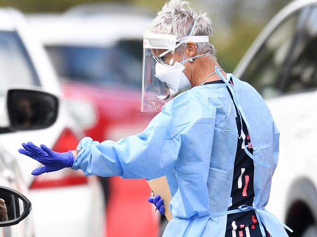 BRISBANE, AUSTRALIA - NewsWire Photos - SEPTEMBER 30, 2021.A health worker processes members of the public at a drive through Covid-19 testing clinic at Murarrie in Brisbane. Picture: NCA NewsWire / Dan Peled