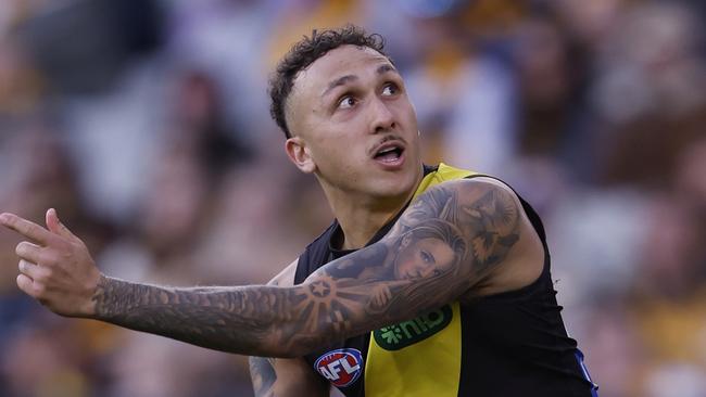 MELBOURNE, AUSTRALIA - AUGUST 18:  Shai Bolton of the Tigers kicks a goal during the round 23 AFL match between Hawthorn Hawks and Richmond Tigers at Melbourne Cricket Ground, on August 18, 2024, in Melbourne, Australia. (Photo by Darrian Traynor/Getty Images)