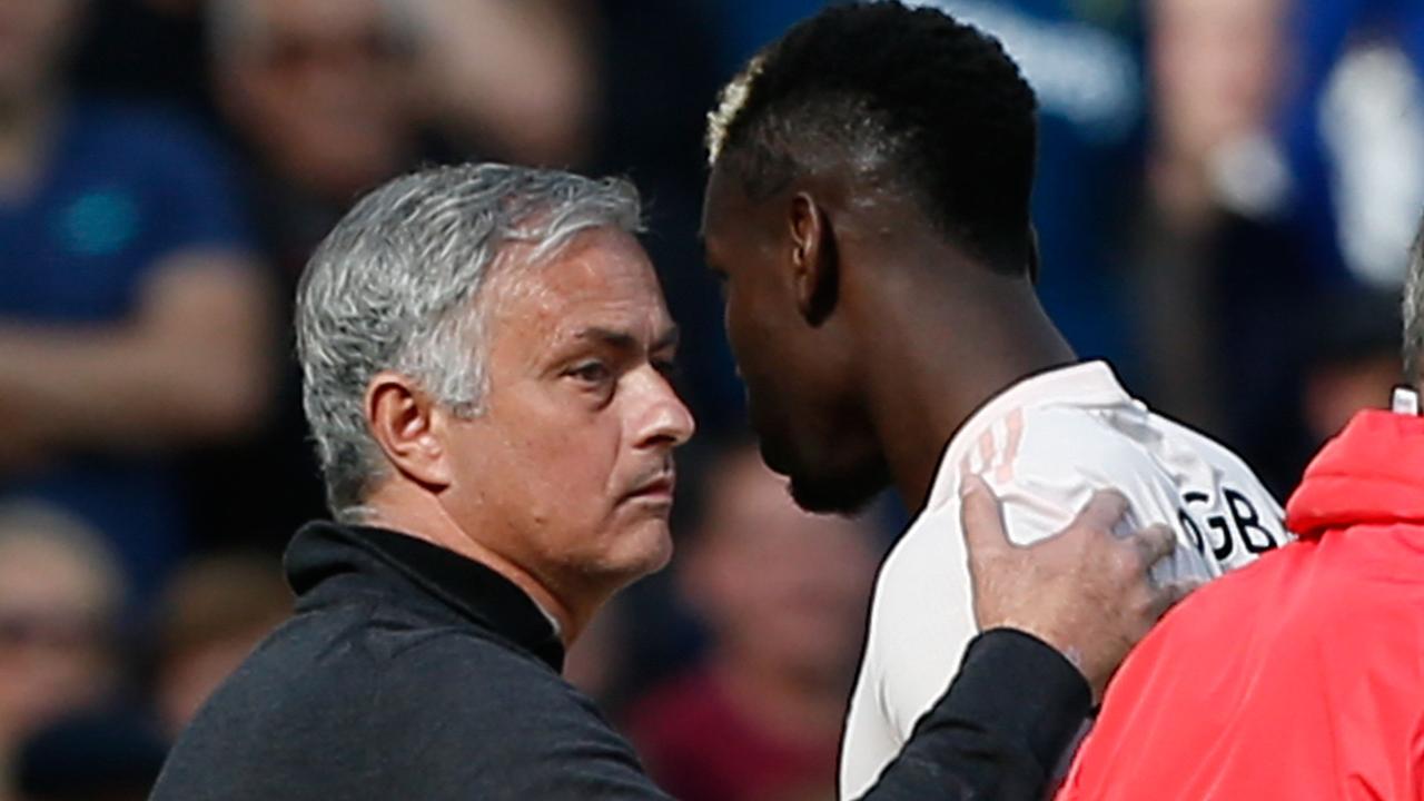 Paul Pogba passes Jose Mourinho after being substituted.