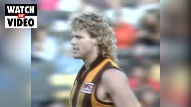Dermott Brereton charges through huddle