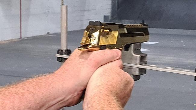 A customer shoots at the newly opened Gold Coast Indoor Shooting Centre. The public shooting gallery is on the same premises as the Southport Indoor Pistol Club at 76 Ferry Rd, Southport on the Gold Coast: Picture: Jodie Munro O'Brien** This photo has been flipped from its original**