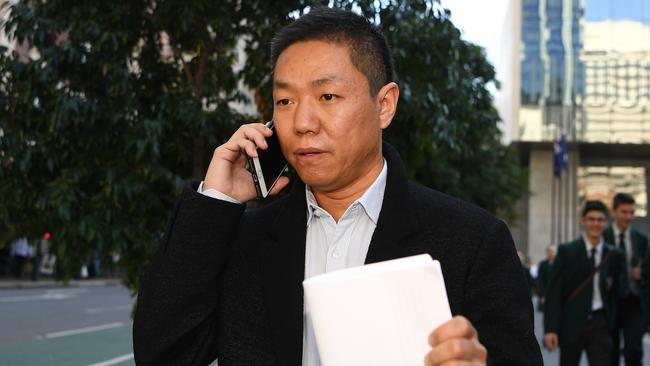 Xin Li leaves at the District Court in Brisbane today. Picture: Dan Peled/AAP