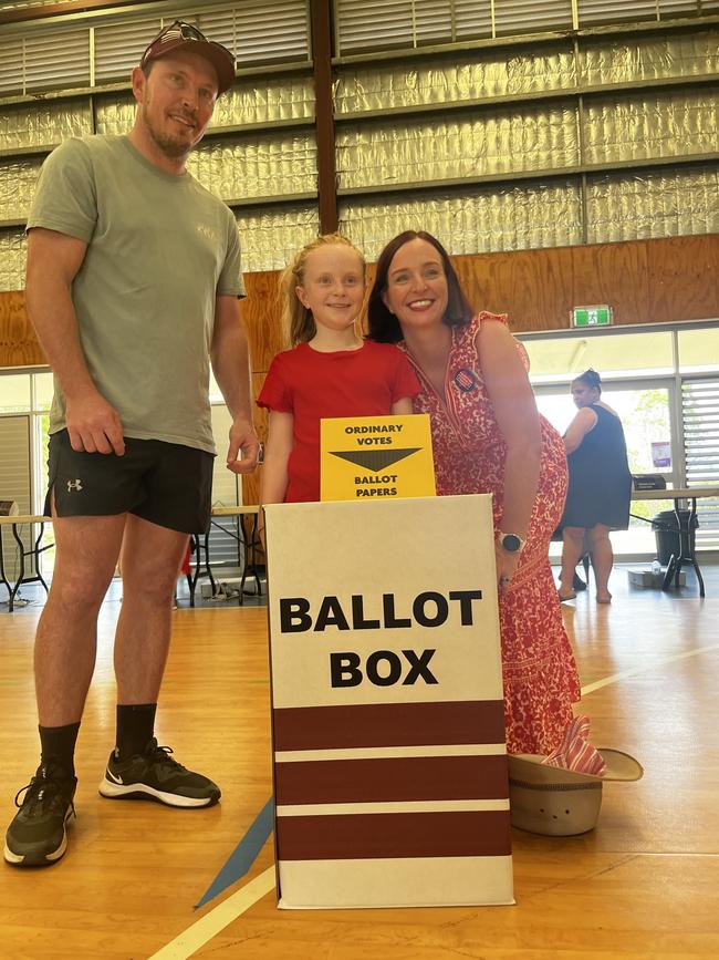 Labor Keppel MP Brittany Lauga voting at the Mount Archer State School polling booth with her daughter and partner in tow on the Queensland state election day on October 26, 2024. Picture: Emma McBryde