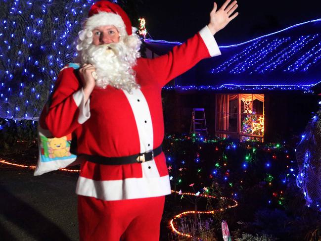 12/12/14 - The Simone Crescent Christmas lights have been compared to Lobethal. There's about 28 houses that take part, with Santa making an appearance each night in the 7 days until Christmas. They hand out lollie bags and collect donations for cancer research at FMC. Picture Dean Martin