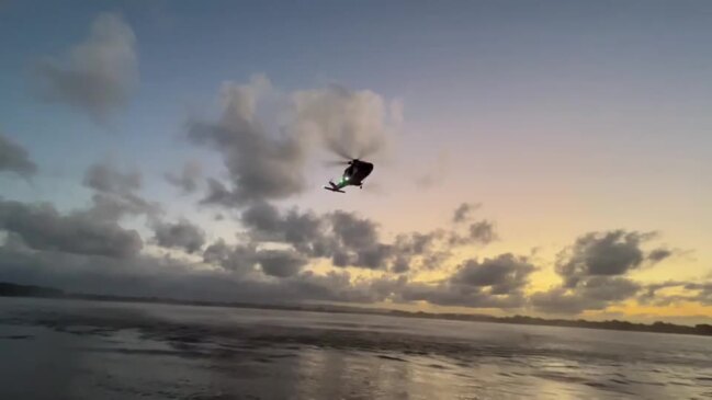 Rescue chopper departs the scene after a dramatic rescue, Jacobs Well.