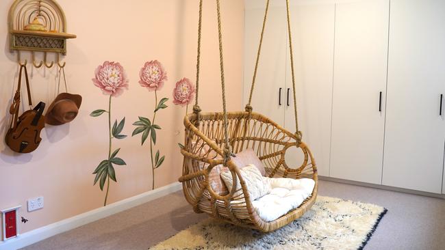 AFTER: Extra space in the children’s bedroom meant a cane swing chair could be installed. Picture: Katrina Lezaic