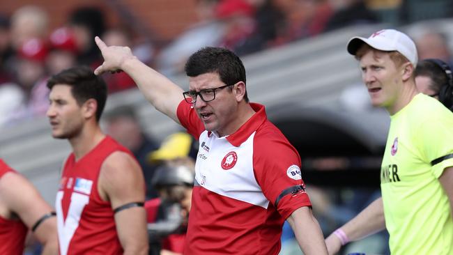 North Adelaide coach Josh Carr on the boundary line with Rooster Aidan Tropiano during the controversial preliminary final victory. Picture: Sarah Reed