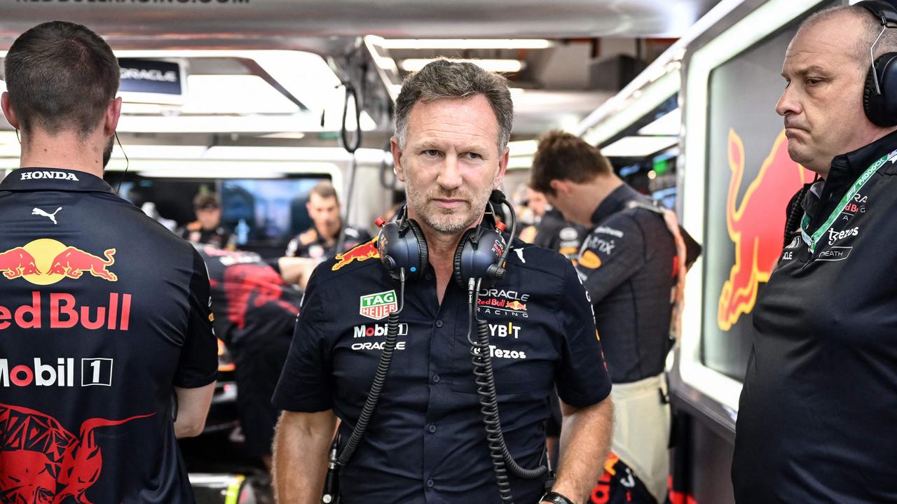 Red Bull Racing's team chief Christian Horner (C).