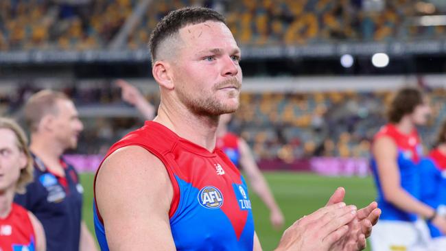 BRISBANE, AUSTRALIA - AUGUST 19: Steven May of the Demons acknowledges fans after the 2022 AFL Round 23 match between the Brisbane Lions and the Melbourne Demons at The Gabba on August 19, 2022 in Brisbane, Australia. (Photo by Russell Freeman/AFL Photos via Getty Images)