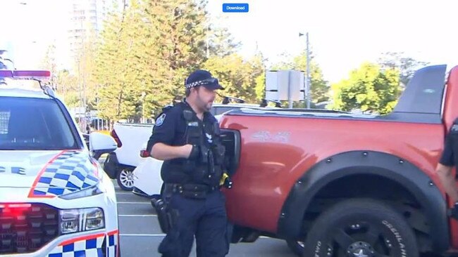 Police beside the car which was shot at. Picture: 9 News Gold Coast.